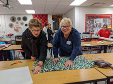 Two members work on a project